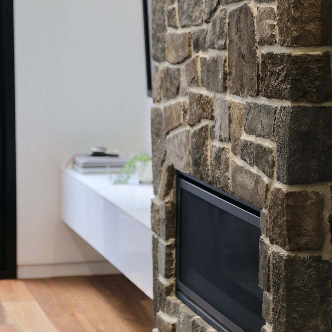 statement fireplace created by El’ise and Matt using PGH’s Palisades Ancient Villa Ledgestone.