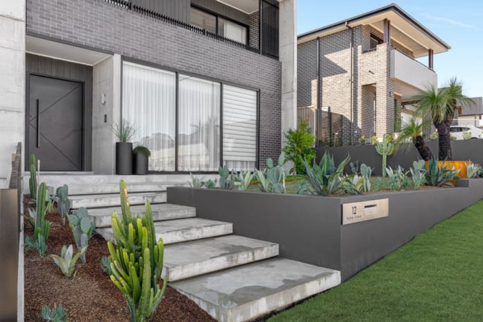 PGH Bricks sleek Morada bricks in Nero Satin connecting the inside with the out in a Sydney home.