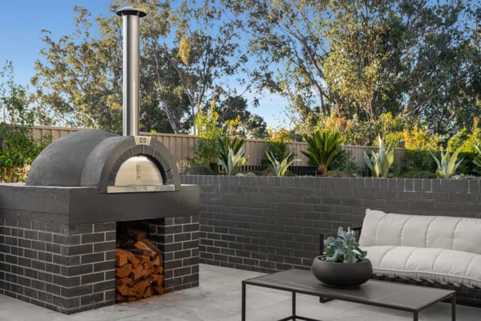 PGH Bricks sleek Morada bricks in Nero Satin connecting the inside with the out in a Sydney home.