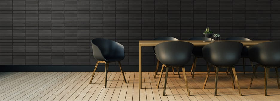 Morada dark brick behind chair and table setting.