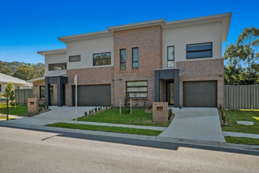 Newcastle Homebuilder using Nickel Flash brick from PGH Metallic range to create a beautiful contemporary townhouse development and ensure it was safe from bushfires.
