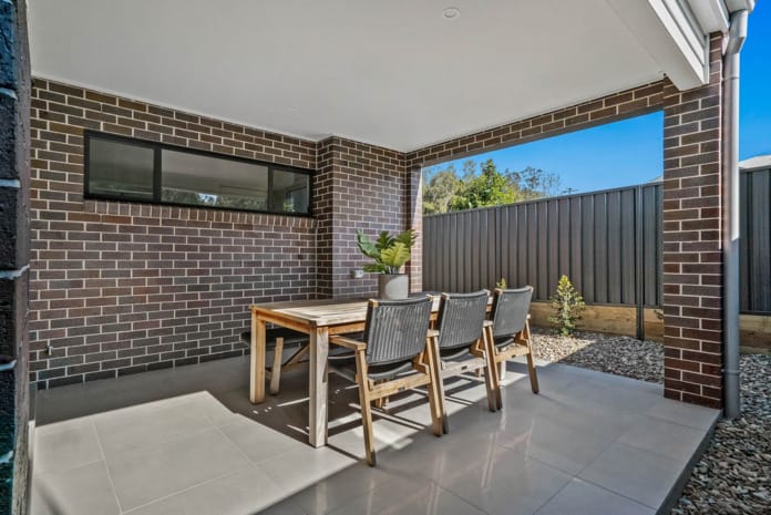 Newcastle Homebuilder using Nickel Flash brick from PGH Metallic range to create a beautiful contemporary townhouse development and ensure it was safe from bushfires.
