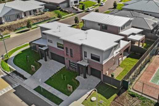 Newcastle Homebuilder using Nickel Flash brick from PGH Metallic range to create a beautiful contemporary townhouse development and ensure it was safe from bushfires.