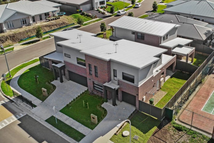 Newcastle Homebuilder using Nickel Flash brick from PGH Metallic range to create a beautiful contemporary townhouse development and ensure it was safe from bushfires.
