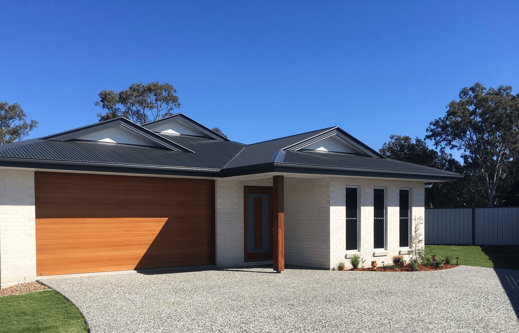 Salt brick from PGH in Zen by Nature range front of house with timber garage door feature