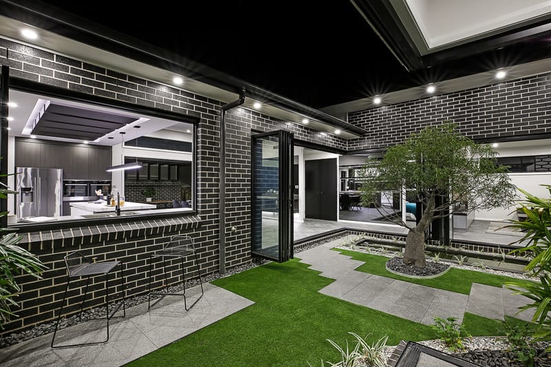 Exterior bricks used in stylish interior designer home.