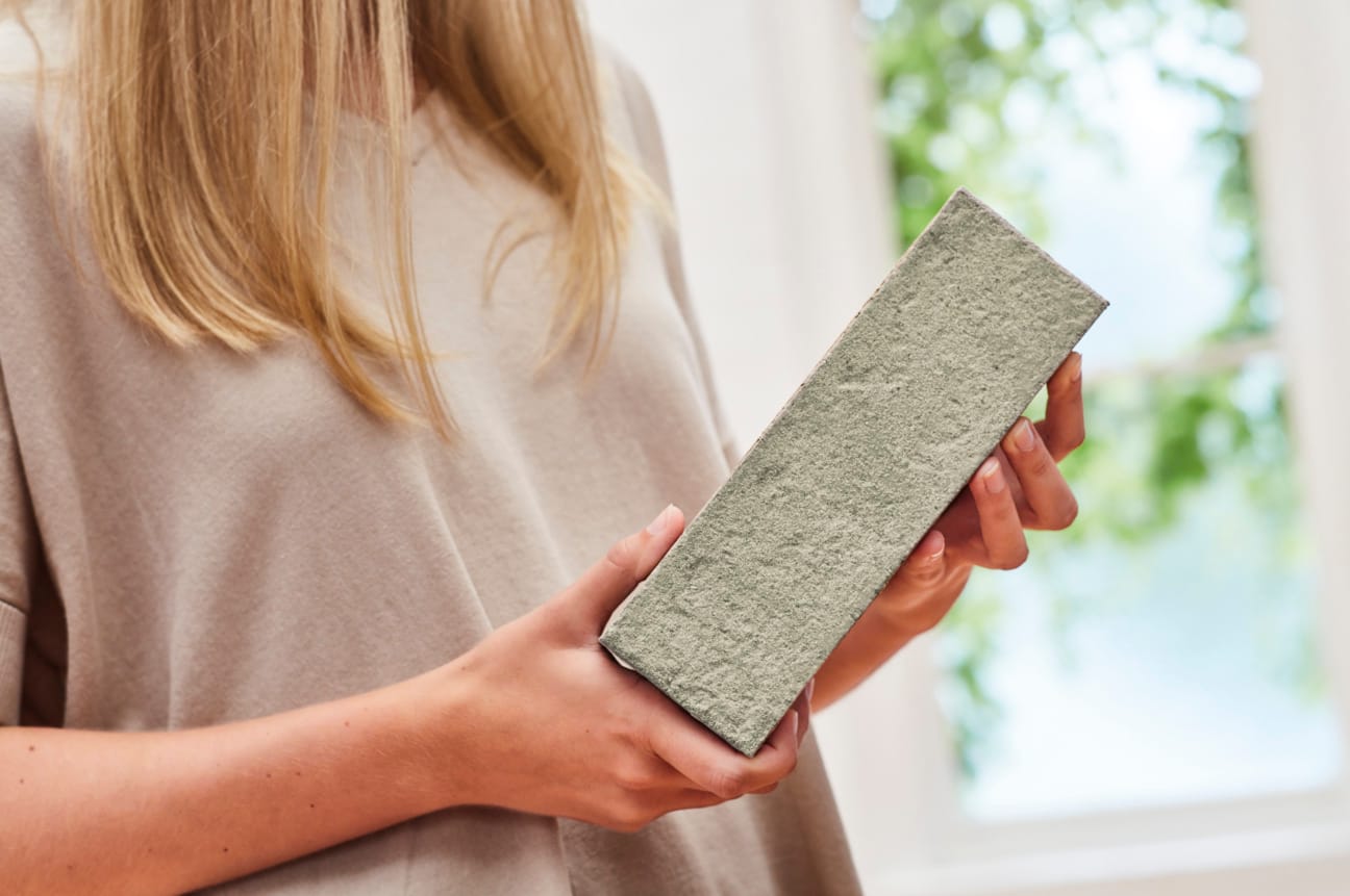 Woman holding a brick