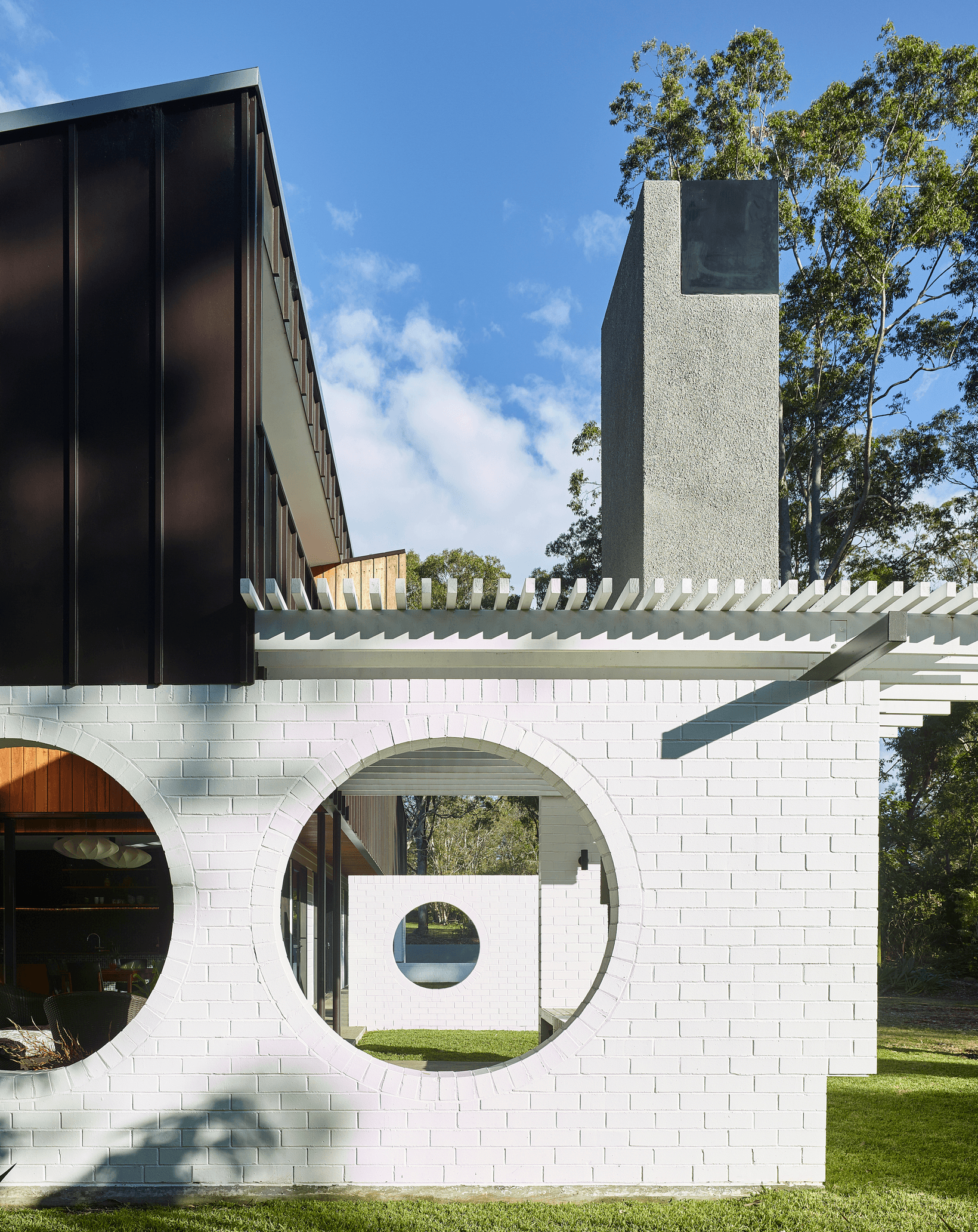 The Long House using Commons bricks painted white.