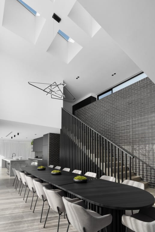 PGH Bricks sleek Morada bricks in Nero Satin connecting the inside with the out in a Sydney home.