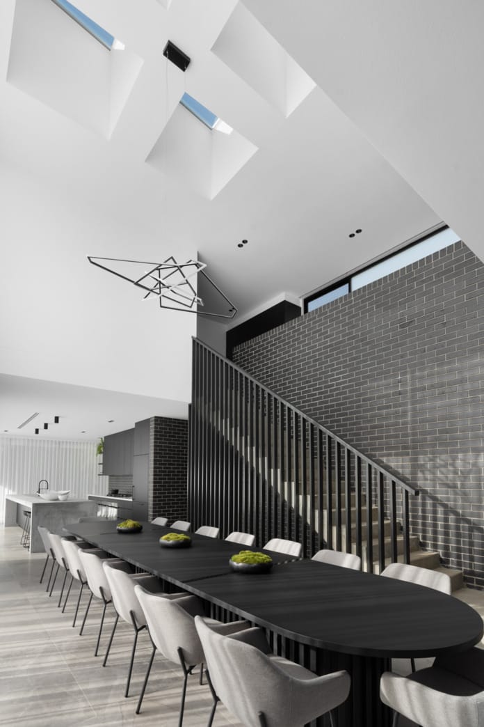 PGH Bricks sleek Morada bricks in Nero Satin connecting the inside with the out in a Sydney home.