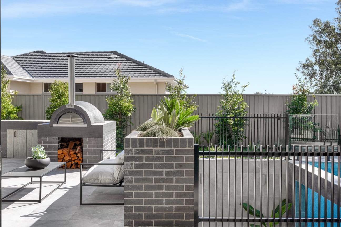 PGH Bricks sleek Morada bricks in Nero Satin connecting the inside with the out in a Sydney home.
