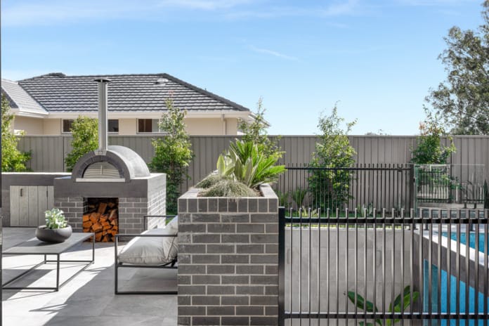 PGH Bricks sleek Morada bricks in Nero Satin connecting the inside with the out in a Sydney home.