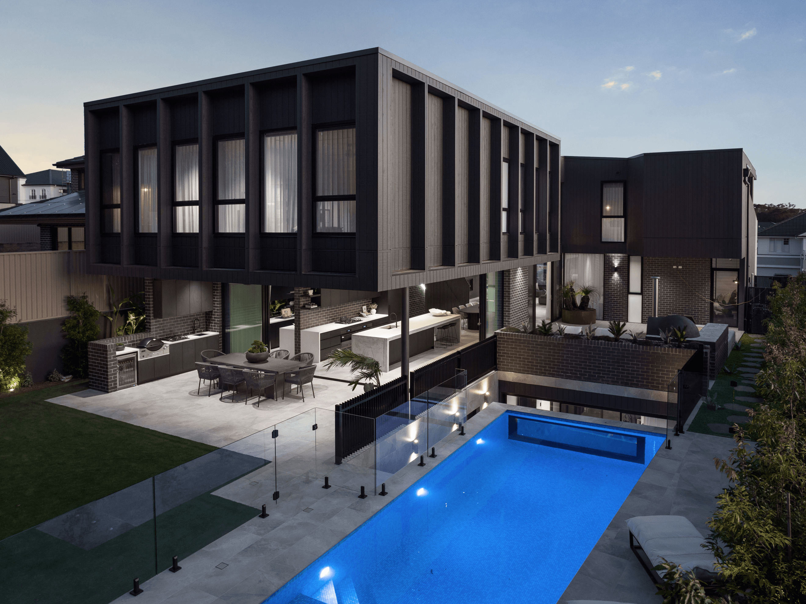 Nero Satin brick from PGH in Morada range with backyard pool and entertaining area, Edgecliff Homes