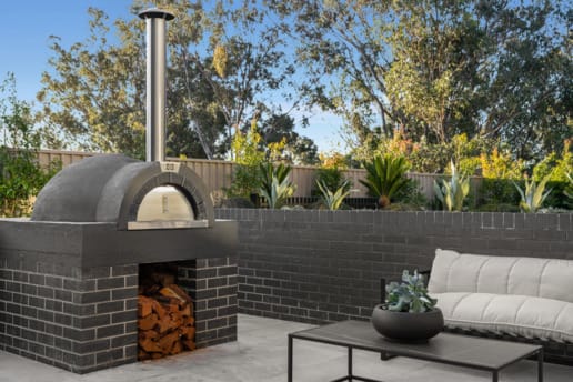 PGH Bricks sleek Morada bricks in Nero Satin connecting the inside with the out in a Sydney home.