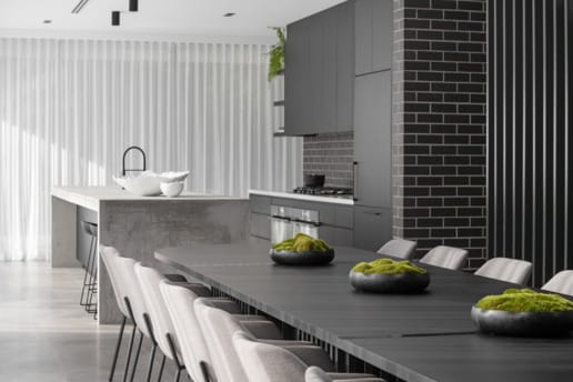 PGH Bricks sleek Morada bricks in Nero Satin connecting the inside with the out in a Sydney home.