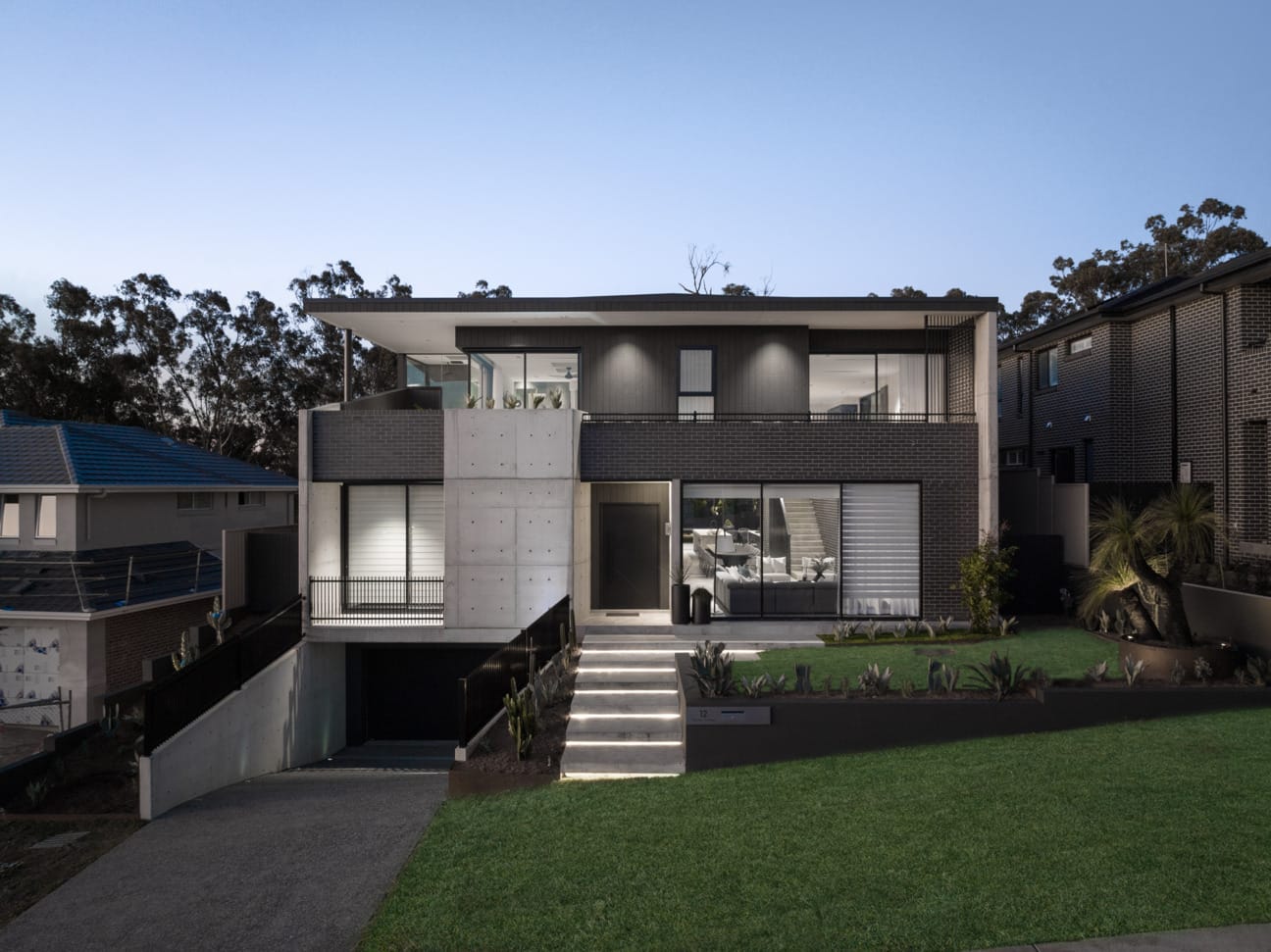 PGH Bricks sleek Morada bricks in Nero Satin connecting the inside with the out in a Sydney home.