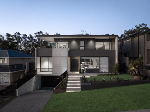 PGH Bricks sleek Morada bricks in Nero Satin connecting the inside with the out in a Sydney home.