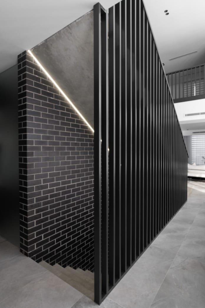 PGH Bricks sleek Morada bricks in Nero Satin connecting the inside with the out in a Sydney home.