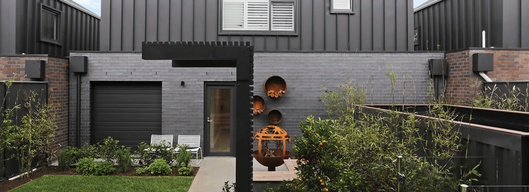 Metallic range bricks using dark coloured bricks in a designer residential home.