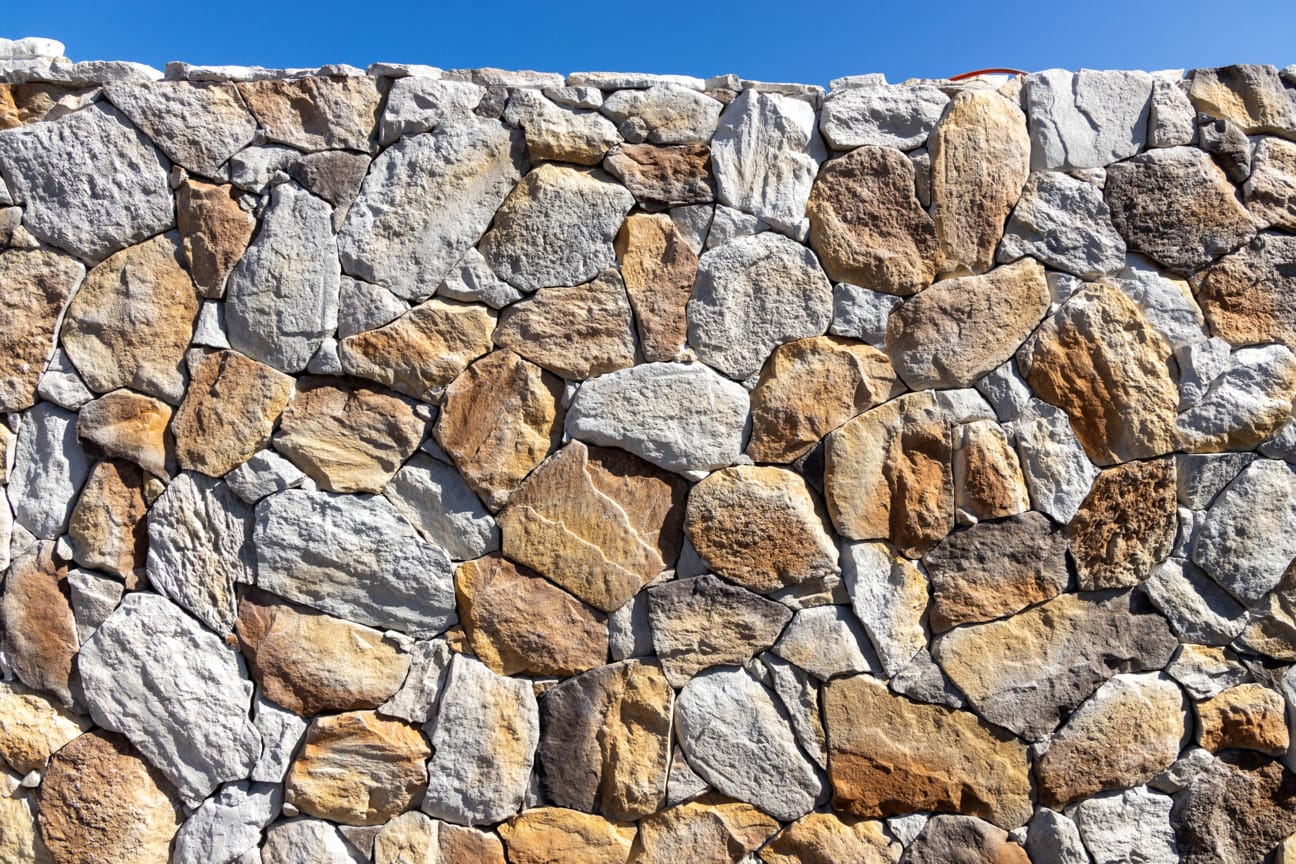PGH Stone Natural Fieldstone Range in Gilded Sand installed on a wall