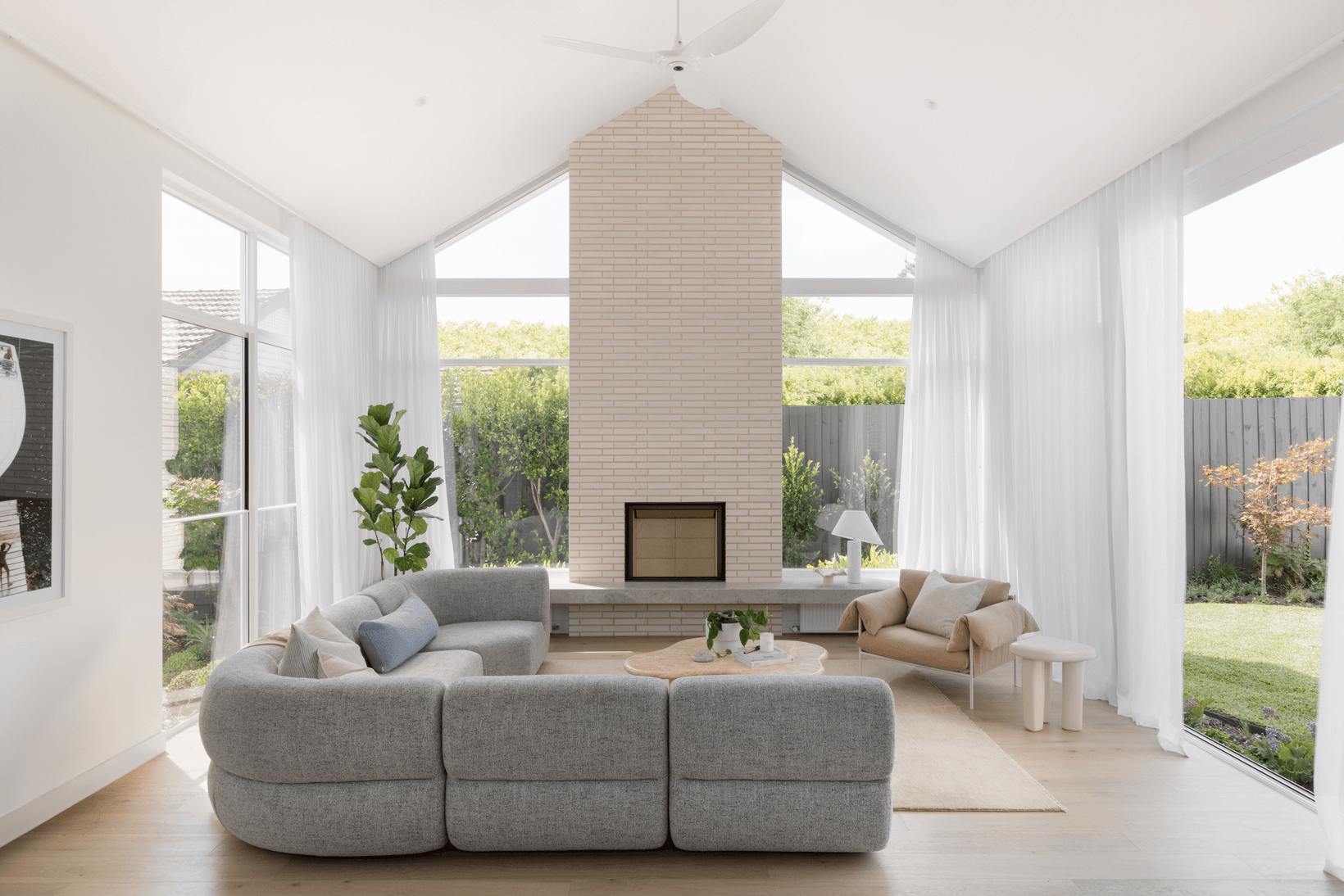 Blanco Linear brick from PGH in Morada range on feature fireplace living area