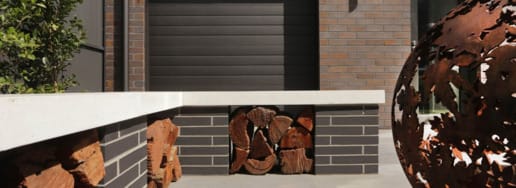 DIY brick bench project with slots for firewood storage