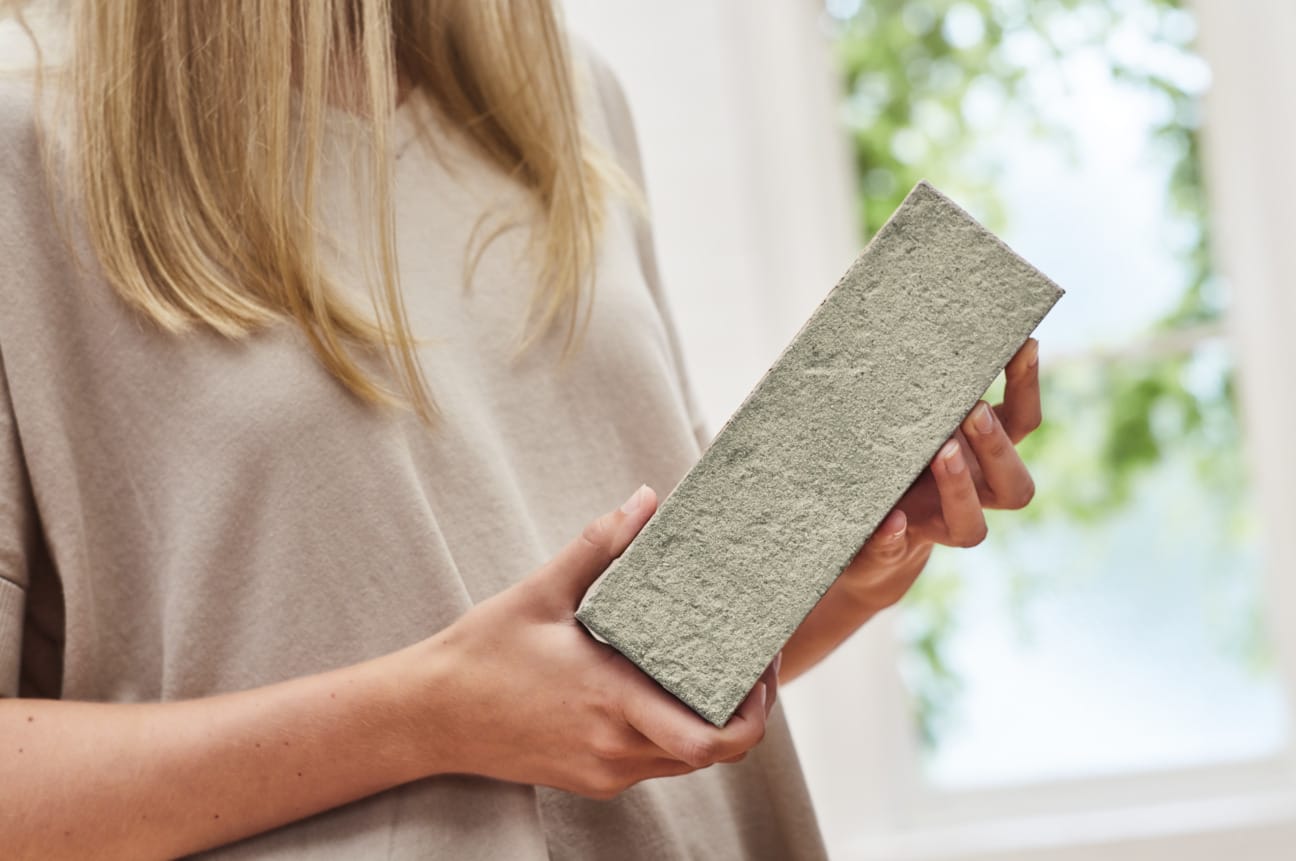 Woman holding a brick