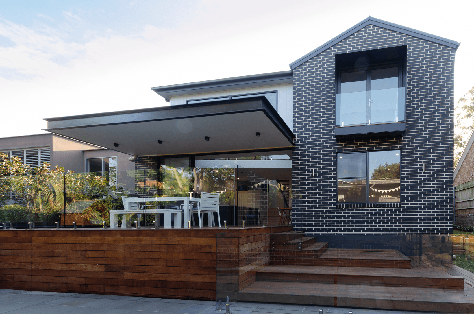 Espresso brick exterior house outdoor entertaining