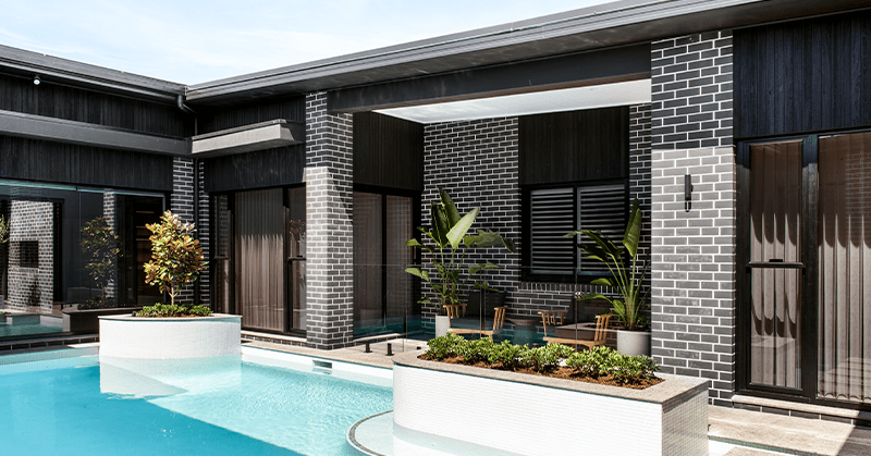 Nero brick from PGH in Morada range backyard pool and entertaining area